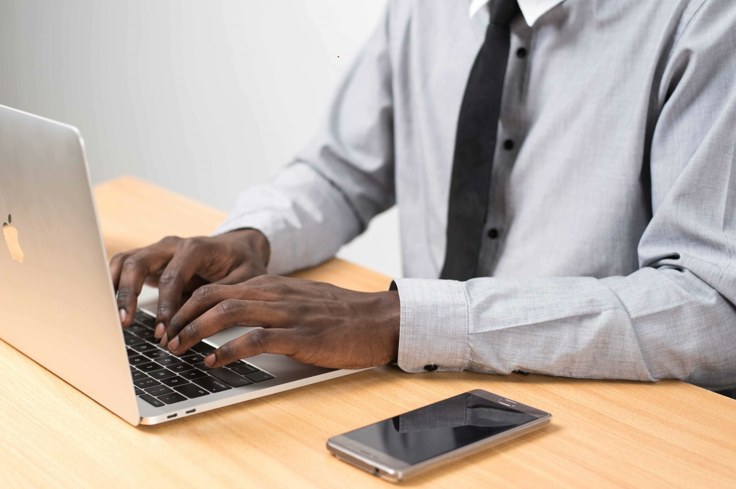 image of black man working at computer