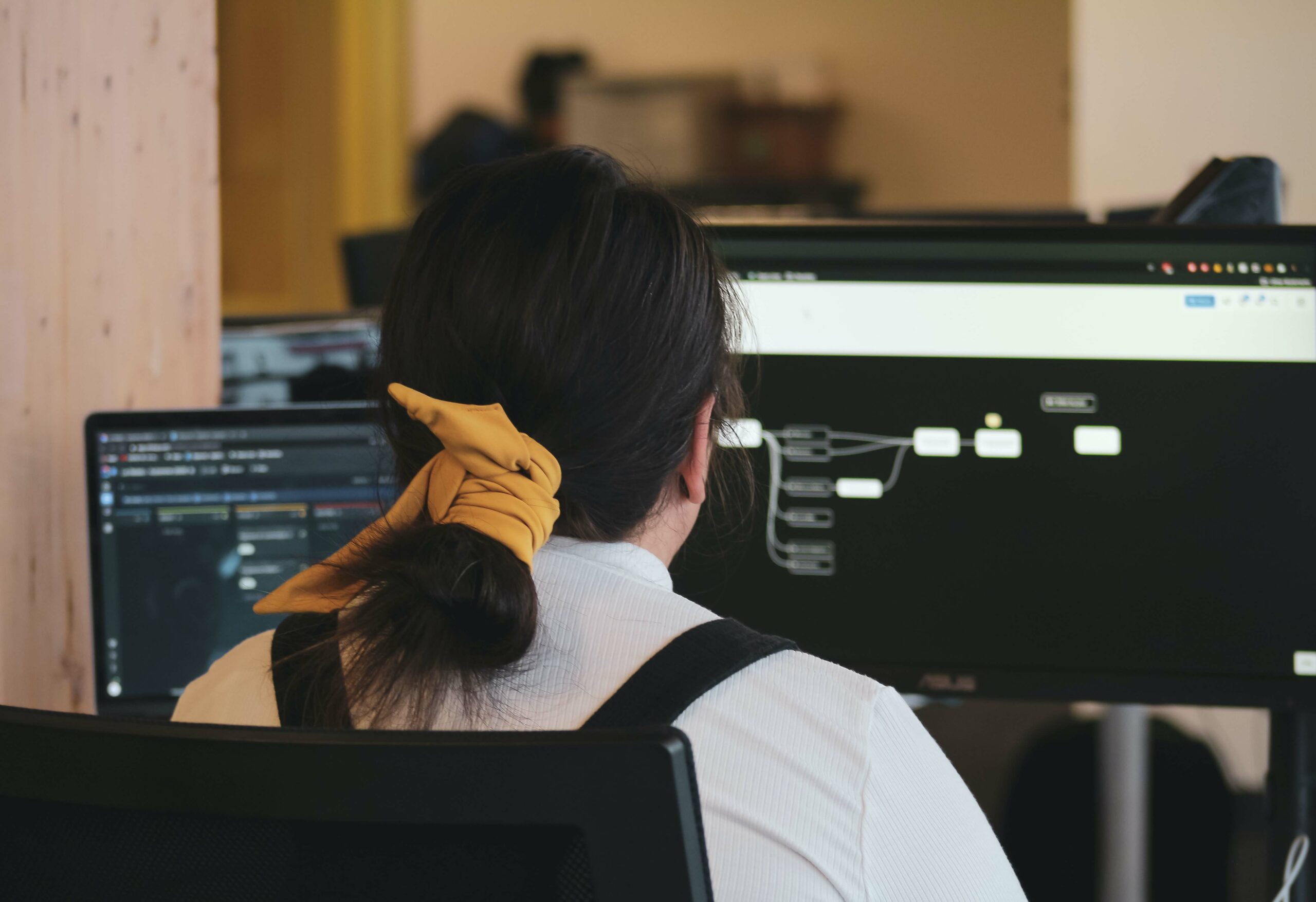 Image of a woman sitting a computer